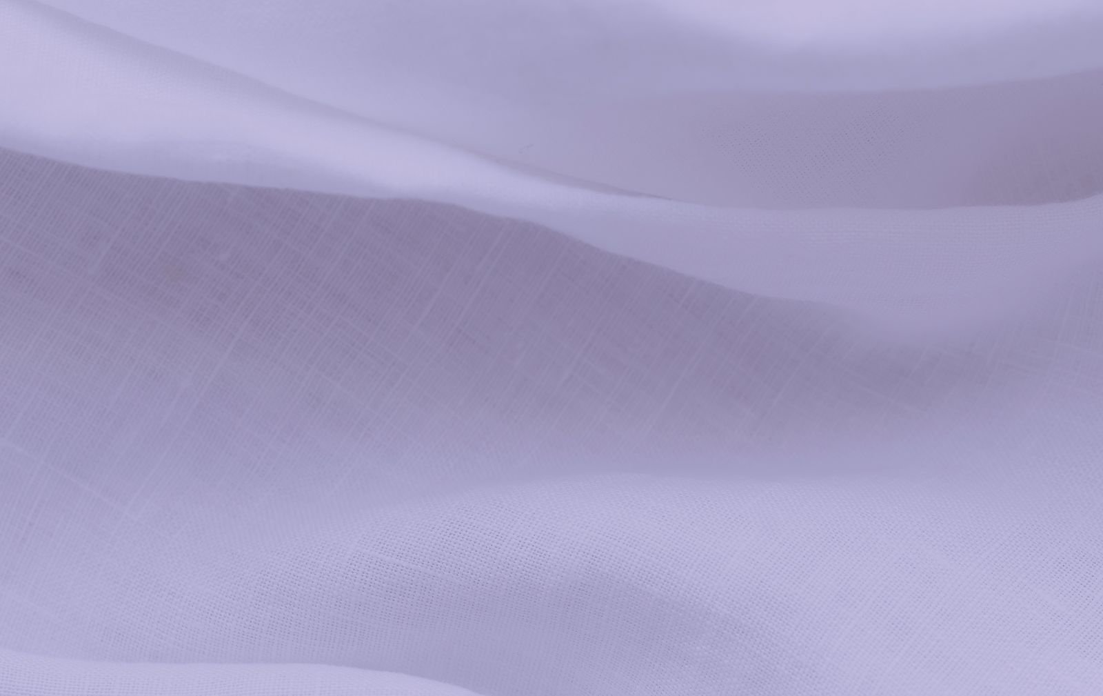 Soft purple fabric with gentle waves and texture.
