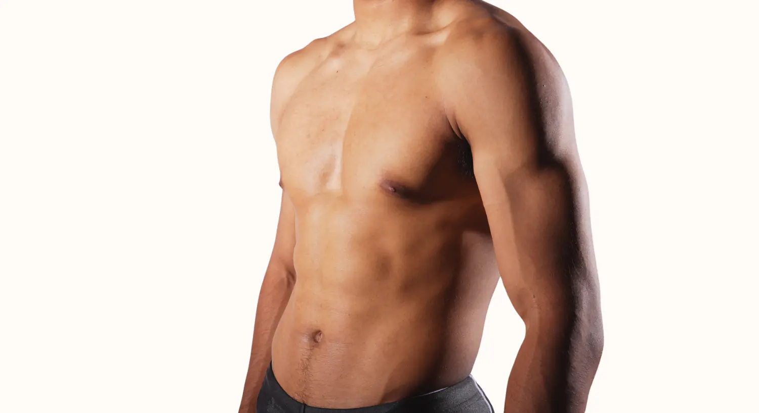 Male torso with defined abs and shorts.